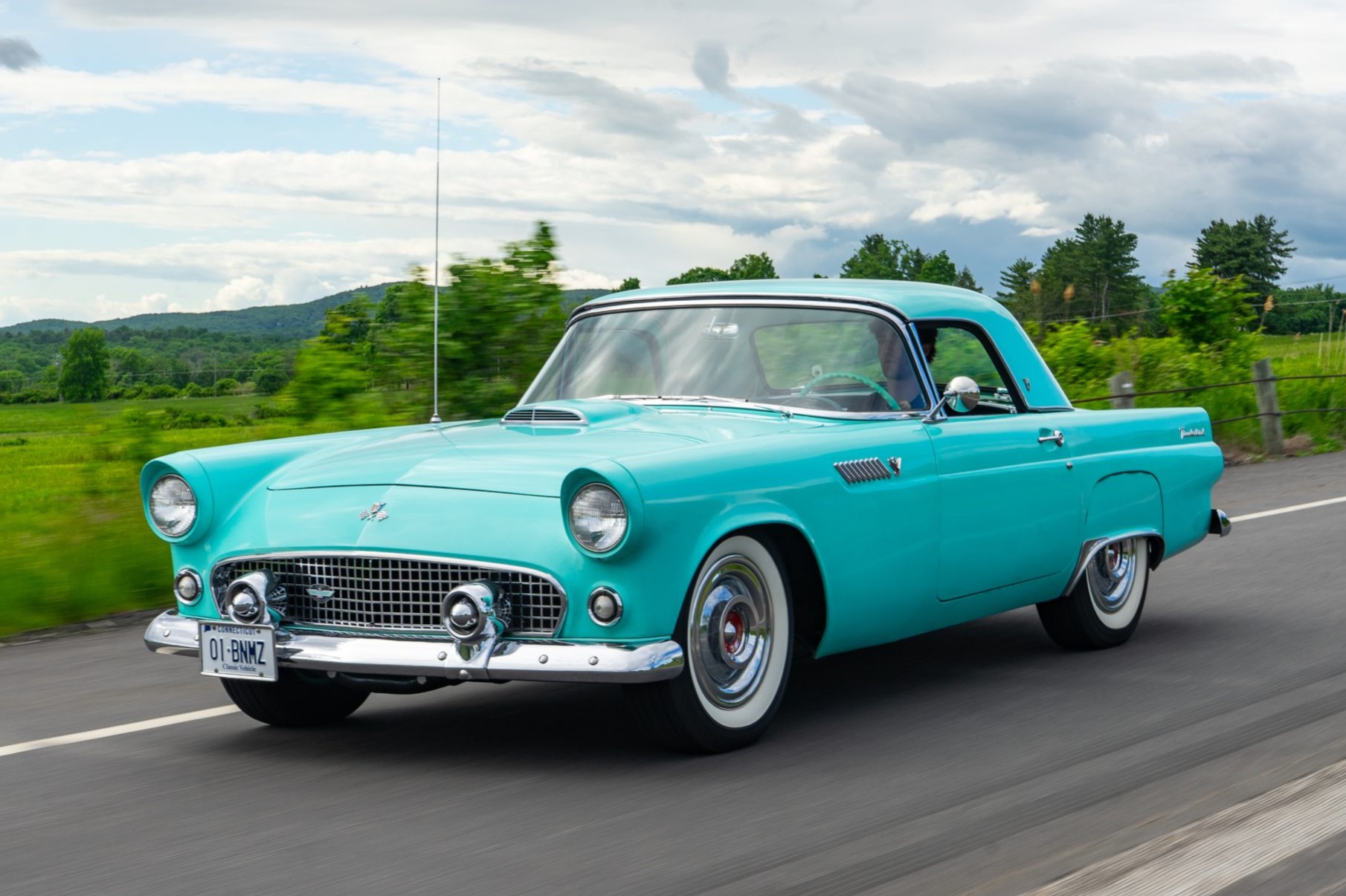 This 1955 Ford Thunderbird is powered by a 292ci V8 paired with a three-speed Fordomatic automatic transmission, and it is finished in turquoise over turquoise and white pleated vinyl. Equipment includes a removable hardtop, a black soft top, power steering, …