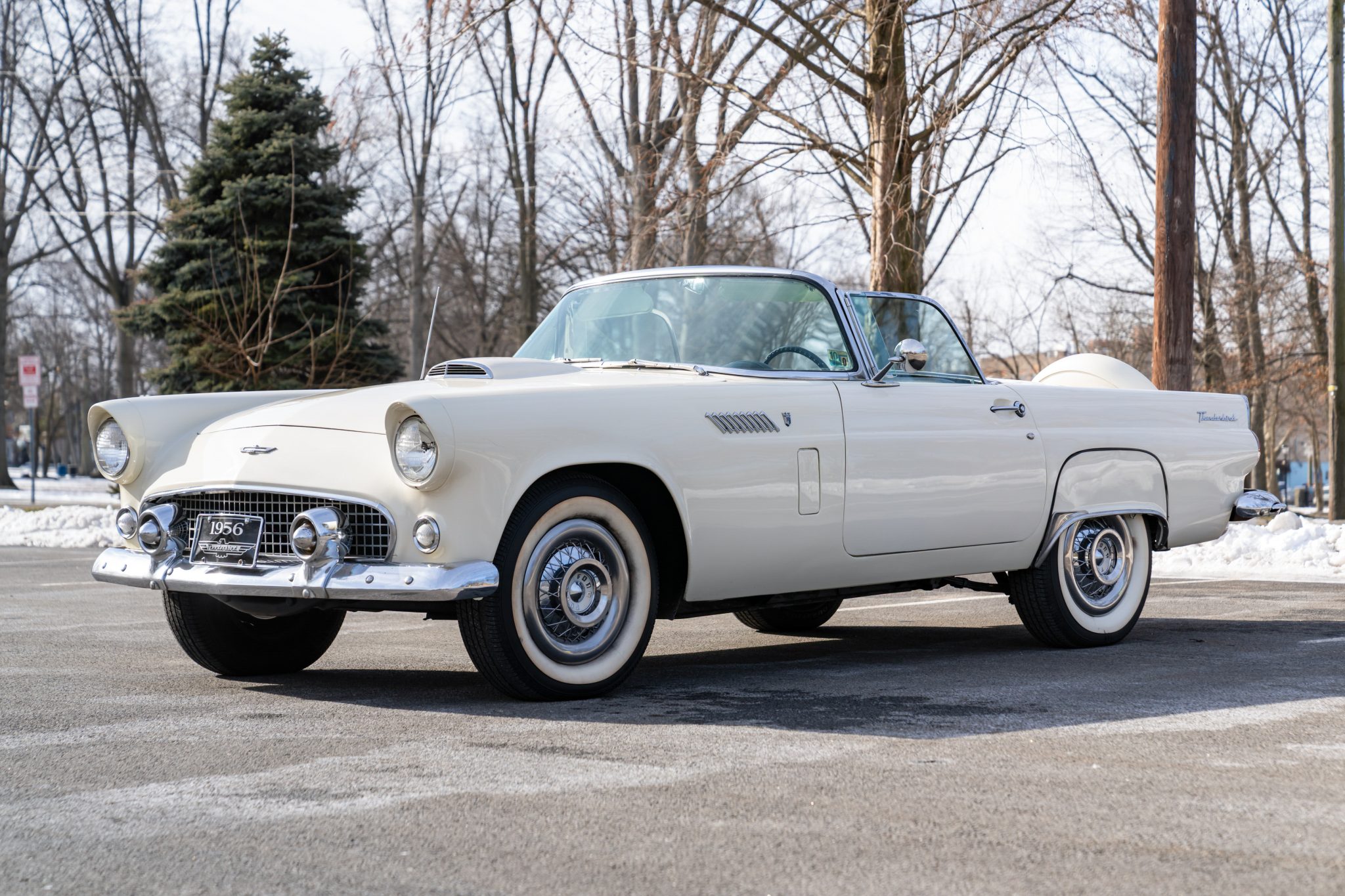 This 1956 Ford Thunderbird is powered by a 312ci V8 equipped with an Edelbrock carburetor, and it is paired with a three-speed automatic transmission. Finished in Colonial White over black and white upholstery, the car is also equipped with whitewall tires, a…